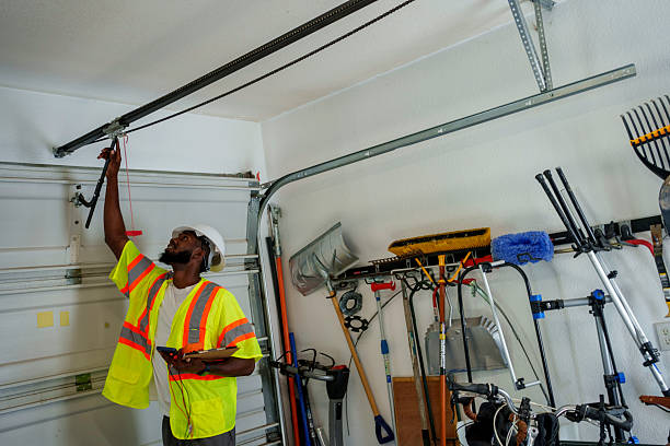 Professional Garage Door Panel Replacement technician working in Manson, WA